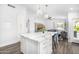 Bright, open kitchen with marble island seating and an open living room view, great for entertaining and Gathering time at 528 E Kyle Ct, Gilbert, AZ 85296