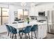 Bright kitchen featuring a large island with seating, pendant lighting, and stainless steel appliances at 528 E Kyle Ct, Gilbert, AZ 85296