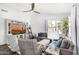 Bright living room featuring a large TV, comfortable seating, and stylish decor, perfect for relaxation and entertainment at 528 E Kyle Ct, Gilbert, AZ 85296