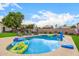 Inviting pool area with chaise lounges and fun floats, perfect for summer relaxation and recreation at 528 E Kyle Ct, Gilbert, AZ 85296