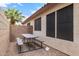 Cozy side yard with a picnic table on a neutral stone base, offering a private outdoor space at 528 E Kyle Ct, Gilbert, AZ 85296