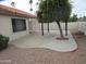 Backyard with desert landscaping, gravel, and concrete patio with shelter at 6230 S Championship Dr, Chandler, AZ 85249