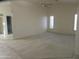 Bedroom featuring plush carpeting, neutral walls, and white plantation shutters at 6230 S Championship Dr, Chandler, AZ 85249