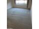 Bedroom featuring plush carpeting, neutral walls, and a window with floral patterned curtains at 6230 S Championship Dr, Chandler, AZ 85249