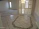 Dining area featuring tile flooring, chandelier lighting, and elegant shuttered windows at 6230 S Championship Dr, Chandler, AZ 85249