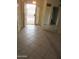 Inviting entryway featuring tile floors, mirrored wall, and secure front door at 6230 S Championship Dr, Chandler, AZ 85249