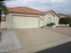 Charming single-story home with a tile roof, front landscaping, and a two-car garage at 6230 S Championship Dr, Chandler, AZ 85249