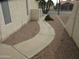 A walkway leads to the house surrounded by desert landscaping and shrubbery at 6230 S Championship Dr, Chandler, AZ 85249
