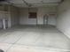 Spacious garage with ample built-in storage cabinets and a water heater at 6230 S Championship Dr, Chandler, AZ 85249
