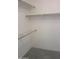 Spacious walk-in closet featuring ample shelving and rod space for storage at 6230 S Championship Dr, Chandler, AZ 85249