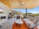 Expansive outdoor balcony featuring a fireplace, seating area and lovely neighborhood views at 6311 E Phoenician Blvd # 19, Scottsdale, AZ 85251