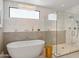 Contemporary bathroom with soaking tub, chandelier, and a glass shower at 6311 E Phoenician Blvd # 19, Scottsdale, AZ 85251