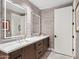 Stylish bathroom featuring double sinks, modern fixtures, illuminated mirrors, and minimalist decor for a clean, luxurious feel at 6311 E Phoenician Blvd # 19, Scottsdale, AZ 85251