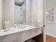 Stylish powder room featuring marble countertop, elegant faucet and decorative accessories at 6311 E Phoenician Blvd # 19, Scottsdale, AZ 85251