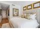 Bright bedroom featuring a large upholstered bed and framed artwork on the wall at 6311 E Phoenician Blvd # 19, Scottsdale, AZ 85251
