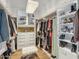 Large walk-in closet featuring lots of racks and storage for clothes and shoes at 6311 E Phoenician Blvd # 19, Scottsdale, AZ 85251