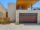 Home's exterior featuring a stylish garage, covered patio, and modern architectural design at 6311 E Phoenician Blvd # 19, Scottsdale, AZ 85251