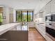 Contemporary kitchen with a large window, light gray cabinets, and state-of-the-art stainless steel appliances at 6311 E Phoenician Blvd # 19, Scottsdale, AZ 85251