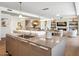 Spacious kitchen with an island and sink, open to the dining and living areas with artistic decor at 6311 E Phoenician Blvd # 19, Scottsdale, AZ 85251