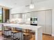 Modern kitchen featuring an island with seating, sleek cabinets, and stainless steel appliances at 6311 E Phoenician Blvd # 19, Scottsdale, AZ 85251