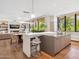 Open concept kitchen with island seating, modern lighting, and seamless flow to the dining and living area at 6311 E Phoenician Blvd # 19, Scottsdale, AZ 85251