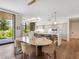 Open kitchen and dining area boasting modern lighting, appliances, and hardwood floors at 6311 E Phoenician Blvd # 19, Scottsdale, AZ 85251