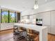 Sleek modern kitchen featuring white cabinets, a large island, and stainless steel appliances at 6311 E Phoenician Blvd # 19, Scottsdale, AZ 85251