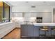 The bright kitchen features an island with bar seating and stainless steel appliances at 6311 E Phoenician Blvd # 19, Scottsdale, AZ 85251