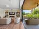 Living room opening onto a patio with comfortable seating and lush greenery at 6311 E Phoenician Blvd # 19, Scottsdale, AZ 85251