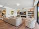 Elegant living room featuring a stone fireplace, built-in shelving, comfortable seating, and ample natural light at 6311 E Phoenician Blvd # 19, Scottsdale, AZ 85251