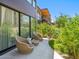 Home's patio area with comfortable lounge chairs and views of the lush landscaping at 6311 E Phoenician Blvd # 19, Scottsdale, AZ 85251