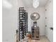 Modern wine cellar featuring a wine rack, wine refrigerator and decorative light fixture at 6311 E Phoenician Blvd # 19, Scottsdale, AZ 85251
