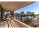 Relax on this balcony with a small table and seating while enjoying views of palm trees and the city at 7167 E Rancho Vista Dr # 4011, Scottsdale, AZ 85251