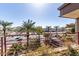Enjoy the views from this balcony overlooking a city intersection, lush landscaping, palm trees and a shopping area at 7167 E Rancho Vista Dr # 4011, Scottsdale, AZ 85251