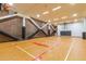Indoor basketball court with finished wood floor and safety wall padding at 7167 E Rancho Vista Dr # 4011, Scottsdale, AZ 85251