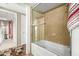 Bathroom featuring glass shower doors and tiled walls at 7167 E Rancho Vista Dr # 4011, Scottsdale, AZ 85251
