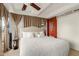 Bedroom featuring bright walls, plush bedding, curtains, and balcony access offering views and natural light at 7167 E Rancho Vista Dr # 4011, Scottsdale, AZ 85251
