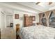 Comfortable bedroom with floral bedding, armoire, and large window with curtains providing natural light at 7167 E Rancho Vista Dr # 4011, Scottsdale, AZ 85251