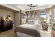 Well-lit bedroom with plush bedding, large windows, and a ceiling fan for added comfort at 7167 E Rancho Vista Dr # 4011, Scottsdale, AZ 85251