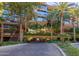 Exterior of the building with covered parking, palm trees, and manicured landscaping at 7167 E Rancho Vista Dr # 4011, Scottsdale, AZ 85251