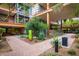 Exterior view of a modern building with well-maintained landscaping and a brick walkway leading to the entrance at 7167 E Rancho Vista Dr # 4011, Scottsdale, AZ 85251