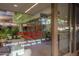 Glass entryway into the business center displaying the concierge desk and operating hours at 7167 E Rancho Vista Dr # 4011, Scottsdale, AZ 85251
