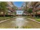 The serene courtyard showcases a water feature surrounded by lush greenery and architecture for relaxing community living at 7167 E Rancho Vista Dr # 4011, Scottsdale, AZ 85251