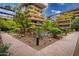 An inviting courtyard featuring a serene pool surrounded by manicured greenery and comfortable seating areas at 7167 E Rancho Vista Dr # 4011, Scottsdale, AZ 85251