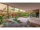A serene courtyard with lush greenery and a patio, providing a private and relaxing outdoor space at 7167 E Rancho Vista Dr # 4011, Scottsdale, AZ 85251
