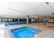 Bright indoor pool and spa area with lap lanes, fitness center view, and lounge seating at 7167 E Rancho Vista Dr # 4011, Scottsdale, AZ 85251