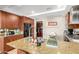 Spacious kitchen with tile floors, stainless steel appliances, and large center island with bar stool seating at 7167 E Rancho Vista Dr # 4011, Scottsdale, AZ 85251