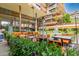 Outdoor dining area with ample seating, lush greenery, and a serene atmosphere at 7167 E Rancho Vista Dr # 4011, Scottsdale, AZ 85251