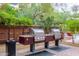 Outdoor grilling area includes two stainless steel gas grills and is surrounded by well maintained landscaping and a pool at 7167 E Rancho Vista Dr # 4011, Scottsdale, AZ 85251