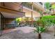 A tranquil patio surrounded by lush greenery, offering a private and relaxing outdoor space at 7167 E Rancho Vista Dr # 4011, Scottsdale, AZ 85251